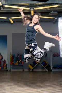 Jumping young dancer during a dance in the gym Stock Photos