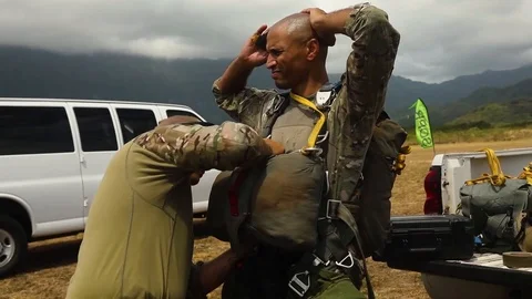 Jumpmaster checking parachute of special operations parachutist Stock Footage 111257610