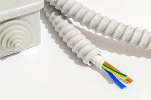 A junction box with wire for repairing electrics in the house on grey backgro Stock Photos