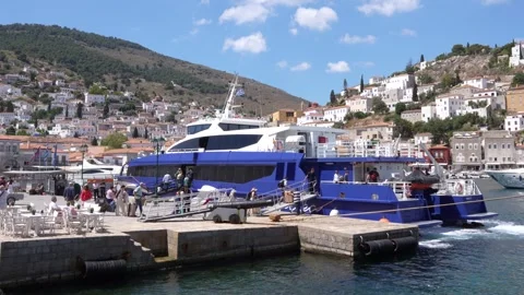 June 1, 2025: Hydra, Greece. Tourists in Greek Island Get Off Ferry. Harbor.. Stock Footage 336594251