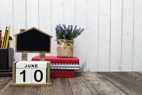 June 10 calendar date text on white wooden block a table. Stock Photos