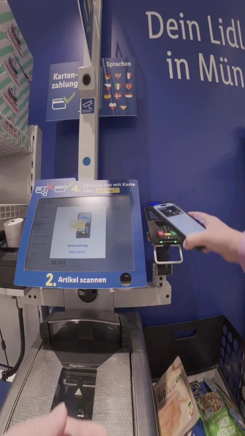 June 15, 2026. Munich, Germany. First-person perspective of a customer using 스톡 동영상 340894258