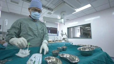 June 2016. A doctor was preparing equipment before the surgery in the operati 스톡 동영상 127567271