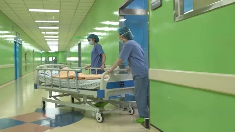 June 2016. Nurses pushing Emergency Stretcher bed in corridor at Medical Univ Stock Footage 127566031