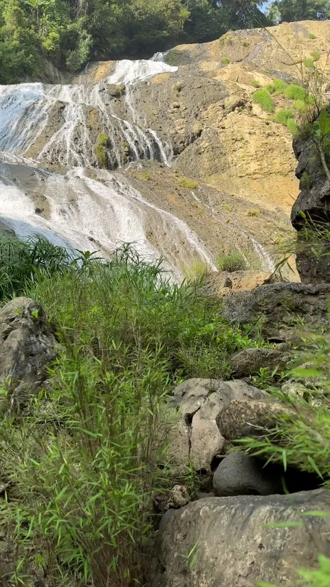 Jungle Waterfall Cascading Down Rocks, Lush Forest, Vertical Shot Stock Footage 325646626