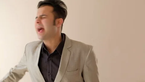 Junior assistant talks towards camera and nods his head in agreement  Stock Footage 100529710