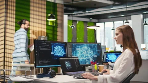 Junior developer in office streamline workflows using AI systems Stock Footage 313168241