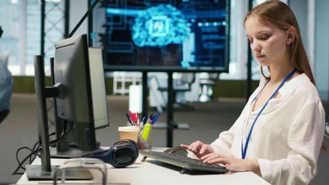 Junior developer optimizing performance using AI LLM chatbot 스톡 동영상 313014641