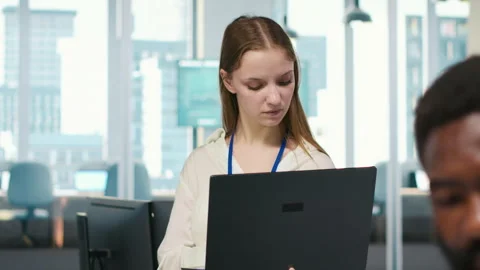 Junior developer utilizing artificial intelligence to optimize performance Stock Footage 313015631
