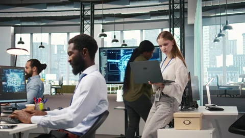Junior developer utilizing artificial intelligence to optimize performance Stock Footage 313018308