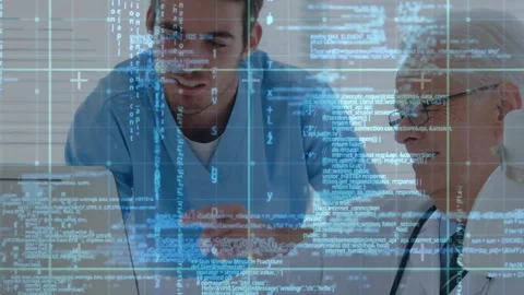 Junior doctor opening laptop, explaining code overlay for data review while Stock Footage 317260614