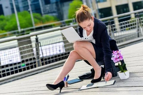 Junior executive dynamic working outside of her office Stock Photos