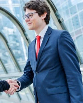 Junior executives dynamics shaking hands Stock Photos
