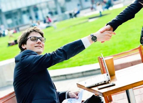 Junior executives dynamics shaking hands Stock Photos