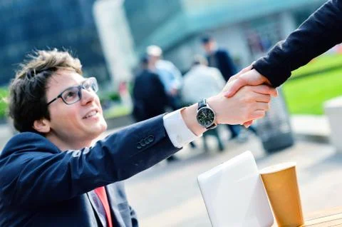 Junior executives dynamics shaking hands Stock Photos