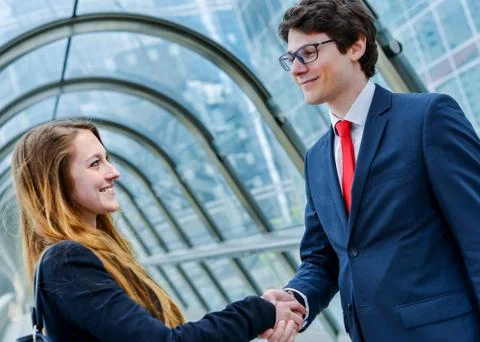 Junior executives dynamics shaking hands Stock Photos