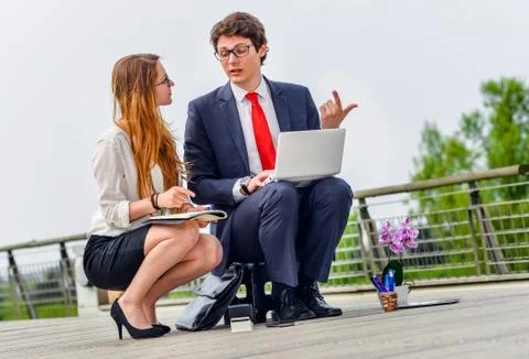 Junior executives dynamics working outside of their office Stock Photos