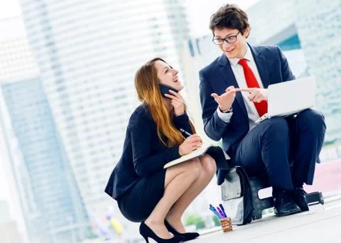 Junior executives dynamics working outside of their office Stock Photos