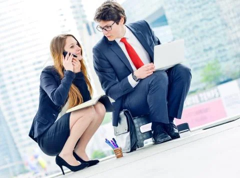 Junior executives dynamics working outside of their office Stock Photos