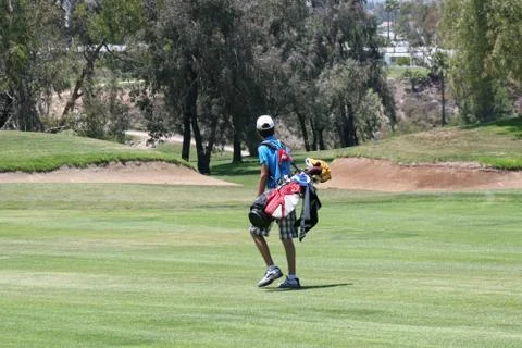 Junior golfer out on course Stock Photos