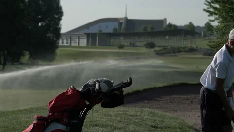 Junior golfer playing golf on summer with hitting shot on green grass Stock Footage 95127714