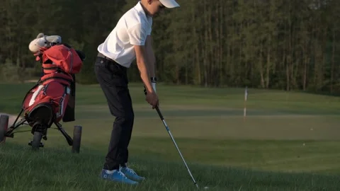 Junior Golfing Into Sunset. Video stock 95120891