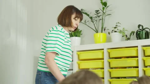 In junior high school, the first grades study at desks with the teacher. Stock Footage 244650829