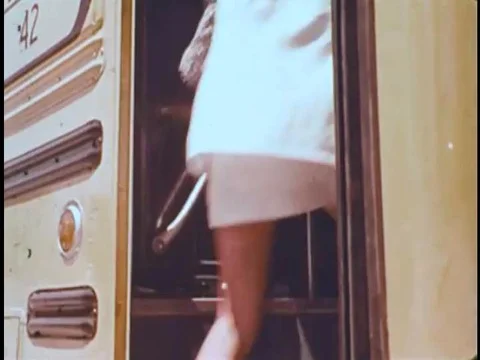 Junior high school students get on a school bus in the 1970s, and their teacher 스톡 동영상 74875486