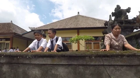 The junior high school students saw the Ngaben ceremony Bali Indonesia Stock Footage 119799712