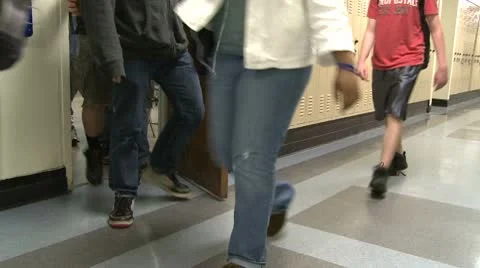 Junior High students walking down hall by lockers (2 of 7 Video stock 10359233