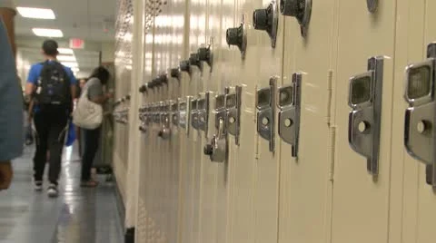 Junior High students walking down hall by lockers (3 of 7) Stock Footage 10359433