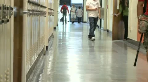 Junior High students walking down hall by lockers (4 of 7) Video stock 10359449