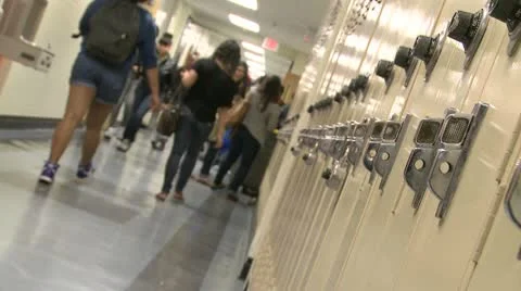 Junior High students walking down hall by lockers (5 of 7) Stock Footage 10360016