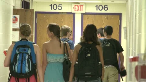 Junior high students walking down hallway  (5 of 8) Stock Footage 10381107
