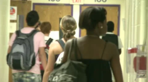 Junior high students walking down hallway  (1 of 8) Stock Footage 10381830