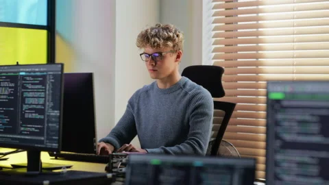 Junior Software Engineer Writing Code In Office Vídeos de archivo 223193886