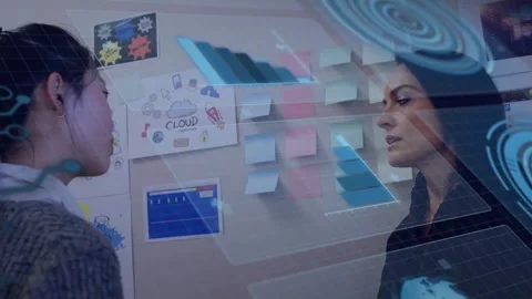 Junior woman pointing at notes and activating holo 3D bars for business, mentor Stock Footage 332468920