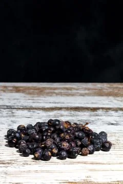 Juniper berries dried on table Stock Photos