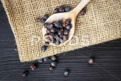 Juniper Berries On Old Wooden Spoon