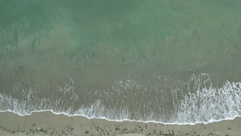 Junk floating by wave to shore, drone view. World ocean pollution. Stock Footage 237210643