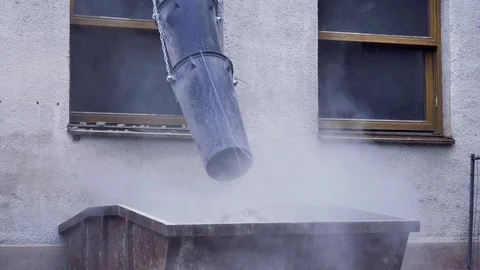 Junk materials falling through plastic sleeve waste tube on building site. Stock Footage 120112099