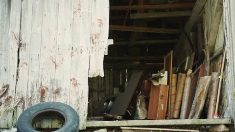 Junk in shed view from outside Stockbeeldmateriaal 130884653