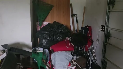 Junk Stacked Inside of House Garage Video stock 213615534