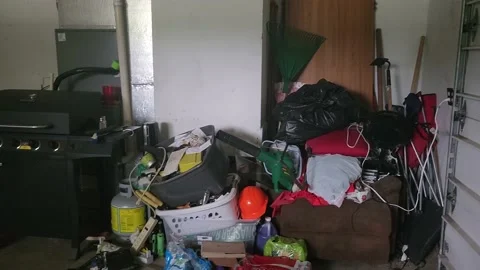 Junk Stacked Inside of House Garage Video stock 213615537