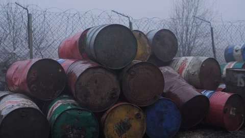 Junk yard with metal barrels Stock Footage 118023915