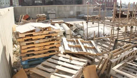 Junk yard with old pallet stacked up Video stock 9863977