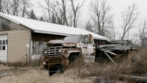 Junked Truck in front of run down barn winter Stock Footage 89945140