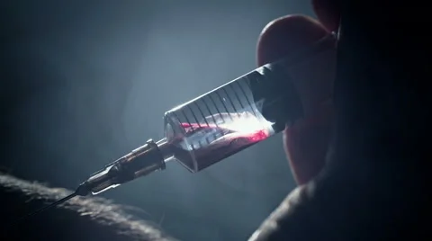 Junkie addict injects heroin or meth by syringe into a vein. Takes blood sample Stock Footage