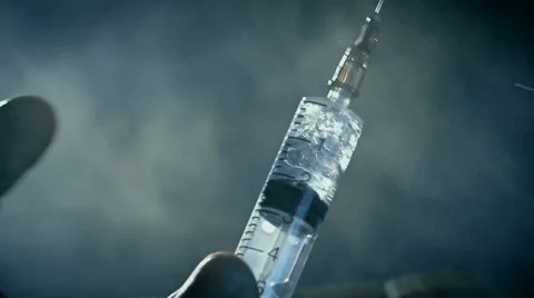 Junkie beat syringe with drug heroin or meth before injection Stock Footage