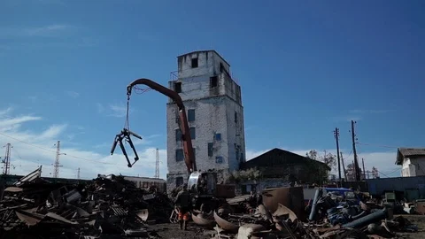 Junkyard crane with hooks moving scrap recycled steel 動画素材 98109772